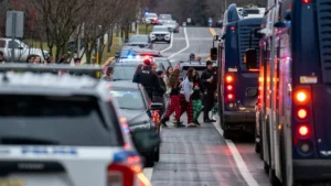 Students from Abundant Life Christian School are escorted to a city bus to be reunited with their parents after a school shooting Monday in Madison, Wisconsin. Andy Manis/Getty Images